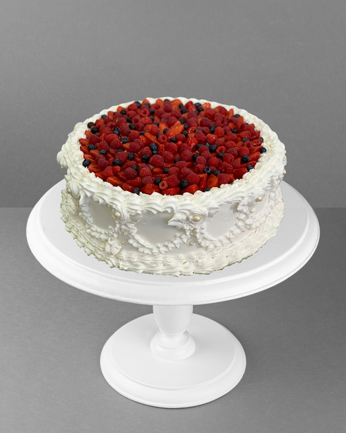 S009 Lace-patterned cake with assorted berries